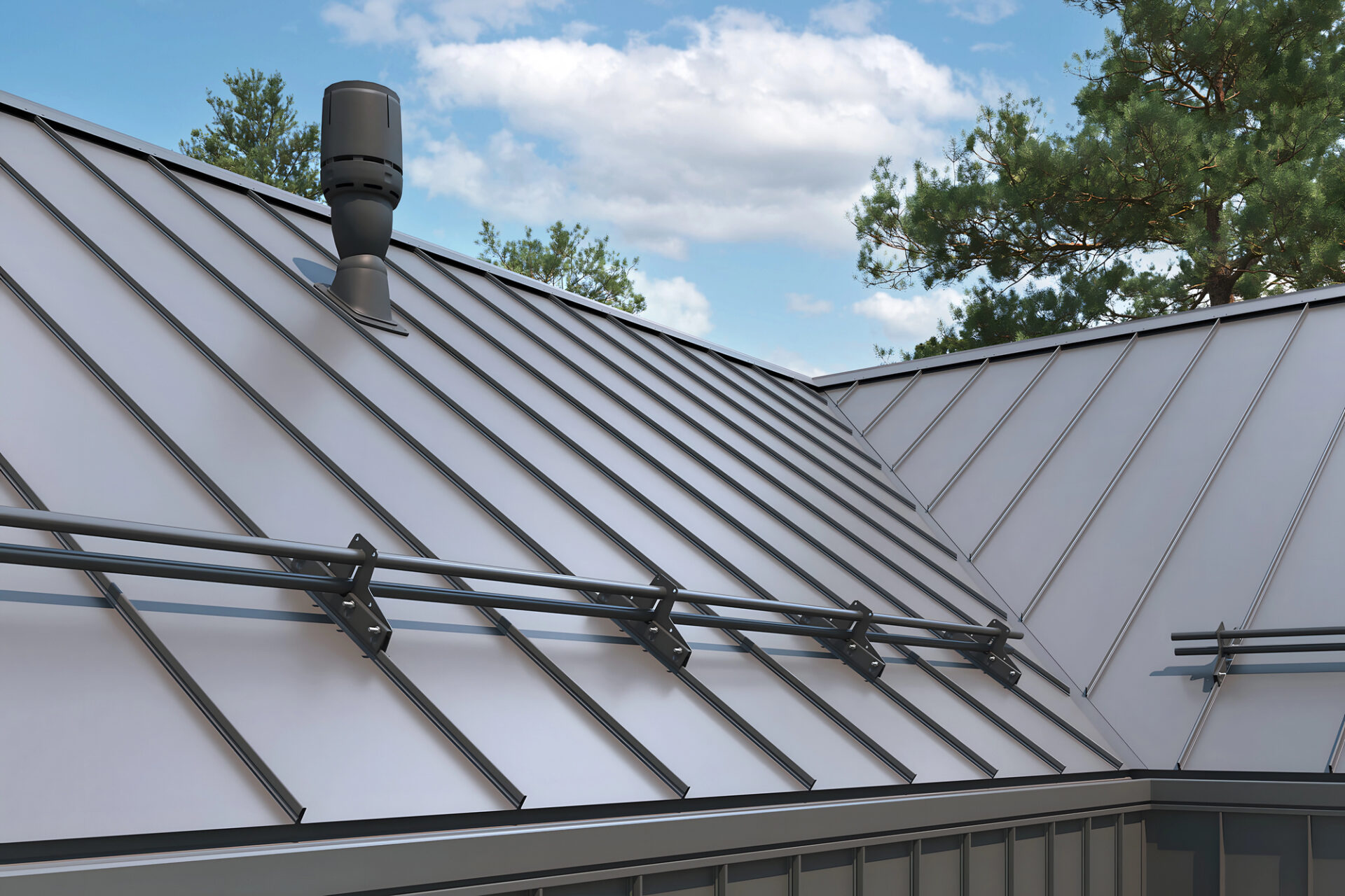 A metal roof with standing seam panels features snow guards and a ventilation pipe, surrounded by trees under a partly cloudy sky. - RoofZen, Chester County PA Roofing, Siding and More